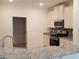 Kitchen with granite countertops and stainless steel appliances at 1143 Freeboard St. # 203, Murrells Inlet, SC 29576