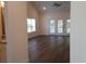 Bright living room with hardwood floors and access to balcony at 1143 Freeboard St. # 203, Murrells Inlet, SC 29576