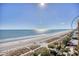 Aerial view showcasing the beach, ocean, and pier at 1200 N Ocean Blvd. # 910, Myrtle Beach, SC 29577