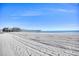 Expansive sandy beach with ocean and pier in the background at 1200 N Ocean Blvd. # 910, Myrtle Beach, SC 29577