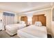 Bedroom with two twin beds and ensuite access at 1200 N Ocean Blvd. # 910, Myrtle Beach, SC 29577