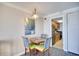 Condo dining area with table and chairs, adjacent to kitchen at 1200 N Ocean Blvd. # 910, Myrtle Beach, SC 29577