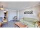Bright living room featuring sofa, coffee table, and dining area at 1200 N Ocean Blvd. # 910, Myrtle Beach, SC 29577