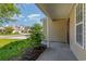 Covered front porch with view of neighborhood and landscaping at 1247 Brighton Ave., Myrtle Beach, SC 29588