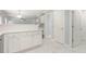 White kitchen with island and marble-look flooring at 1247 Brighton Ave., Myrtle Beach, SC 29588