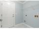 Laundry room with built-in shelving and white door at 1247 Brighton Ave., Myrtle Beach, SC 29588
