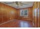 Bedroom with wood paneled walls and hardwood floor at 1302 Richmond Dr., Georgetown, SC 29440