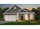 Charming single-Gathering home with a two-car garage and welcoming front porch at 1312 Winding Creek Way, Myrtle Beach, SC 29588