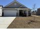 Charming single-Gathering home with a two-car garage and welcoming front porch at 1312 Winding Creek Way, Myrtle Beach, SC 29588