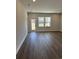 Spacious living room with wood flooring, neutral walls, and natural light at 1312 Winding Creek Way, Myrtle Beach, SC 29588