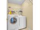 Bright laundry room, washer, dryer, and ample shelving at 1377 Southwood Dr., Myrtle Beach, SC 29575