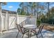 Small patio with table and chairs, ideal for relaxing outdoors at 1408 Sedgefield Dr., Murrells Inlet, SC 29576