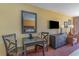 Small dining area with table, chairs, and a dresser at 1501 S Ocean Blvd. # 1418, Myrtle Beach, SC 29577