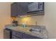 Compact kitchenette with microwave, sink, and mini-fridge at 1501 S Ocean Blvd. # 1418, Myrtle Beach, SC 29577