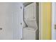 Stackable washer and dryer in a small laundry closet at 1801 N Ocean Blvd. # K1, North Myrtle Beach, SC 29582