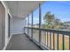 Covered balcony with view of a grassy backyard and trees at 1881 Colony Dr. # 7D, Surfside Beach, SC 29575