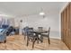 Small dining area with a round wooden table and four chairs at 1881 Colony Dr. # 7D, Surfside Beach, SC 29575