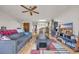 Living room with hardwood floors, gray sofa, and access to balcony at 1881 Colony Dr. # 7D, Surfside Beach, SC 29575