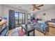 Living room with hardwood floors, gray sofa, and balcony access at 1881 Colony Dr. # 7D, Surfside Beach, SC 29575