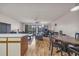 Open living room with hardwood floors, kitchen island, and dining area at 1881 Colony Dr. # 7D, Surfside Beach, SC 29575