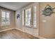 Bright entryway with white door, ship wheel decor, and wood floors at 2225 Oak Creek Ct., North Myrtle Beach, SC 29582