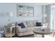 Living area with sofa, coffee table, and ocean-themed decor at 2301 S Ocean Blvd. # 1105, North Myrtle Beach, SC 29582