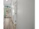 Bright hallway with light gray walls and wood-look floors at 2307 Blackbird Ct., Murrells Inlet, SC 29576