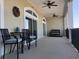 Relax on this balcony with chairs, a table, and beautiful views through arched windows at 257 Venice Way # H 204, Myrtle Beach, SC 29577
