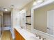 Bright bathroom featuring a double sink vanity, framed mirrors, and a separate tub and shower at 257 Venice Way # H 204, Myrtle Beach, SC 29577
