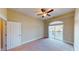 Bedroom with plush carpet, ceiling fan and large window with balcony at 257 Venice Way # H 204, Myrtle Beach, SC 29577