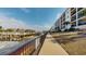 Exterior waterfront view of the condo building with a community pier and intercoastal waterway at 257 Venice Way # H 204, Myrtle Beach, SC 29577