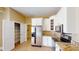 Kitchen with stainless steel appliances, white cabinets, walk-in pantry and granite countertops at 257 Venice Way # H 204, Myrtle Beach, SC 29577