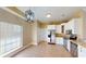 Well-lit kitchen featuring modern lighting, stainless steel appliances, granite countertops, and light tiled floors at 257 Venice Way # H 204, Myrtle Beach, SC 29577