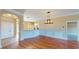 Open concept living room with hardwood floors and view to the kitchen and entry at 257 Venice Way # H 204, Myrtle Beach, SC 29577