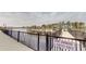 Waterfront view of boat slips and a community pier, featuring a sign that says, 