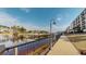 A waterfront view of the intercoastal waterway and community pier, featuring a walking path and condo building at 257 Venice Way # H 204, Myrtle Beach, SC 29577