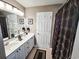 Double vanity bathroom with large mirror and shower/tub combo at 270 Connemara Dr. # C, Myrtle Beach, SC 29579