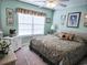 Second bedroom with king-size bed and large window at 270 Connemara Dr. # C, Myrtle Beach, SC 29579