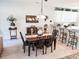 Dining area with dark wood table and chairs near kitchen at 270 Connemara Dr. # C, Myrtle Beach, SC 29579
