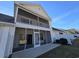 Two-story townhome with a screened porch and private patio at 270 Connemara Dr. # C, Myrtle Beach, SC 29579