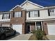 Townhome exterior with brick and vinyl siding, 2-car garage at 270 Connemara Dr. # C, Myrtle Beach, SC 29579