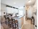 Kitchen with breakfast bar, white cabinets, and view to entry at 270 Connemara Dr. # C, Myrtle Beach, SC 29579