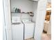 Convenient laundry room with washer and dryer, and shelving at 270 Connemara Dr. # C, Myrtle Beach, SC 29579