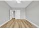 Spacious bedroom with light grey walls and wood-look flooring at 307 Lineback Pl. # 307, Longs, SC 29568