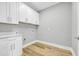 Laundry room with white cabinets and quartz countertop at 307 Lineback Pl. # 307, Longs, SC 29568