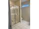 Clean bathroom with walk-in shower and white tile flooring at 35 Dornoch Dr., Pawleys Island, SC 29585