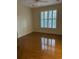 Sunny bedroom with hardwood floors and large window at 35 Dornoch Dr., Pawleys Island, SC 29585