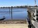 Convenient boat ramp access point, with a wooden pier and clear water, perfect for water activities and boating enthusiasts at 35 Dornoch Dr., Pawleys Island, SC 29585