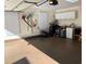 Organized two-car garage with ample storage, lawn equipment, and natural light at 35 Dornoch Dr., Pawleys Island, SC 29585