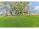 Large backyard with mature trees and lush grass at 3703 Green Sea Rd., Green Sea, SC 29545